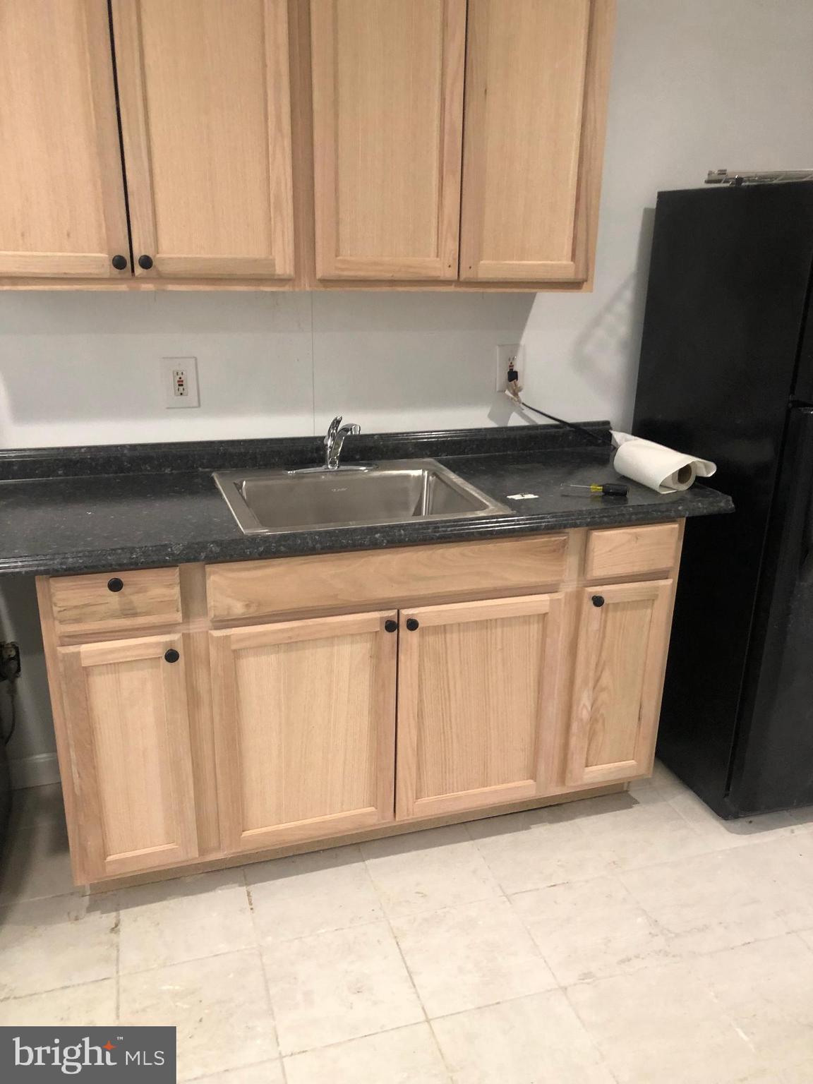 193 Kinsley Road Pemberton, NJ 08068 - Photo 21 of 22 a view of a kitchen with granite countertop white cabinets