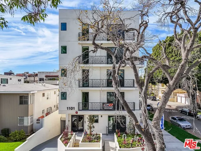 a view of multiple house with yard