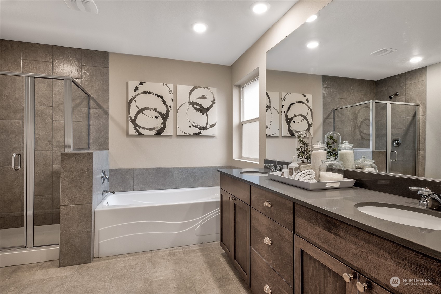 1537 Sultan Basin Road, Unit 1169 Sultan, WA 98294 - Photo 16 of 18 a bathroom with a double vanity sink and a bathtub