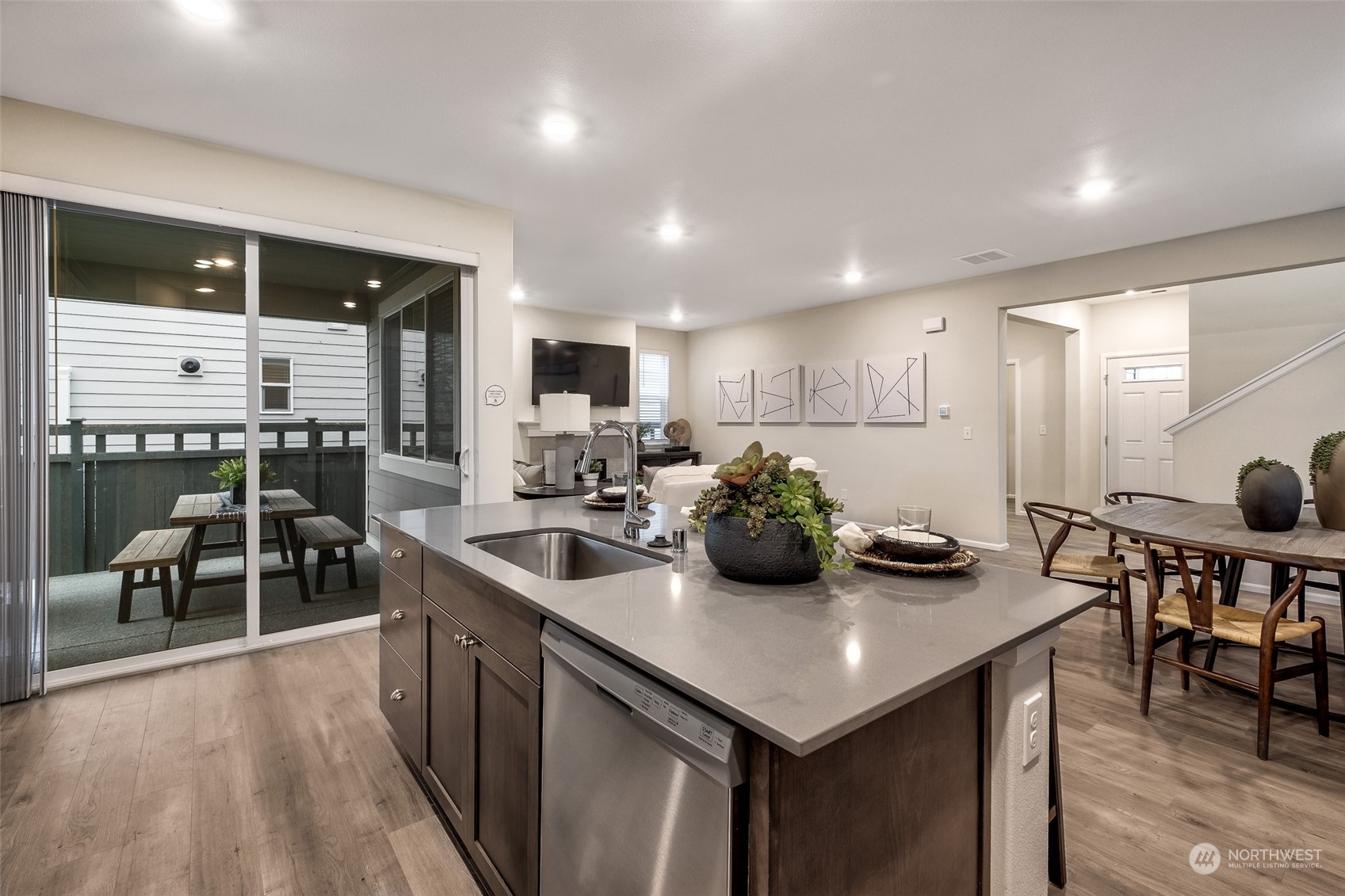 1537 Sultan Basin Road, Unit 1169 Sultan, WA 98294 - Photo 6 of 18 a kitchen with sink a refrigerator and chairs