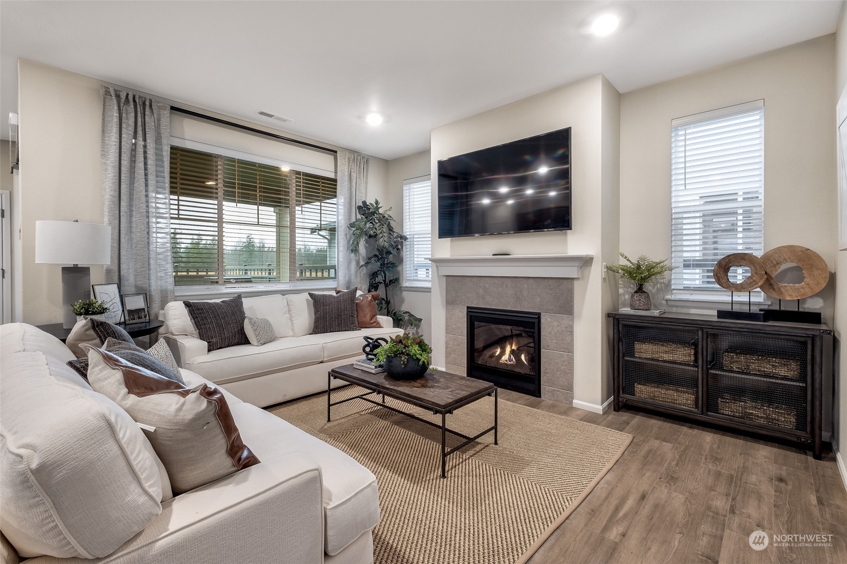 1537 Sultan Basin Road, Unit 1169 Sultan, WA 98294 - Photo 8 of 18 a living room with furniture fireplace and flat screen tv