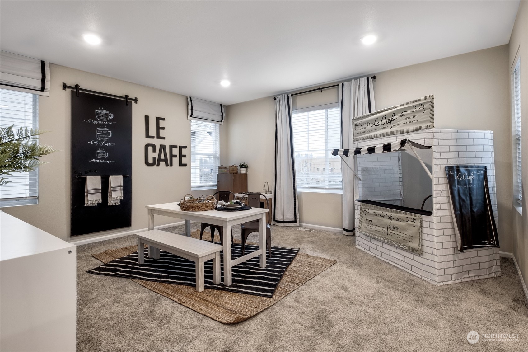 1537 Sultan Basin Road, Unit 1169 Sultan, WA 98294 - Photo 9 of 18 a kitchen with stainless steel appliances kitchen island granite countertop a stove and a refrigerator