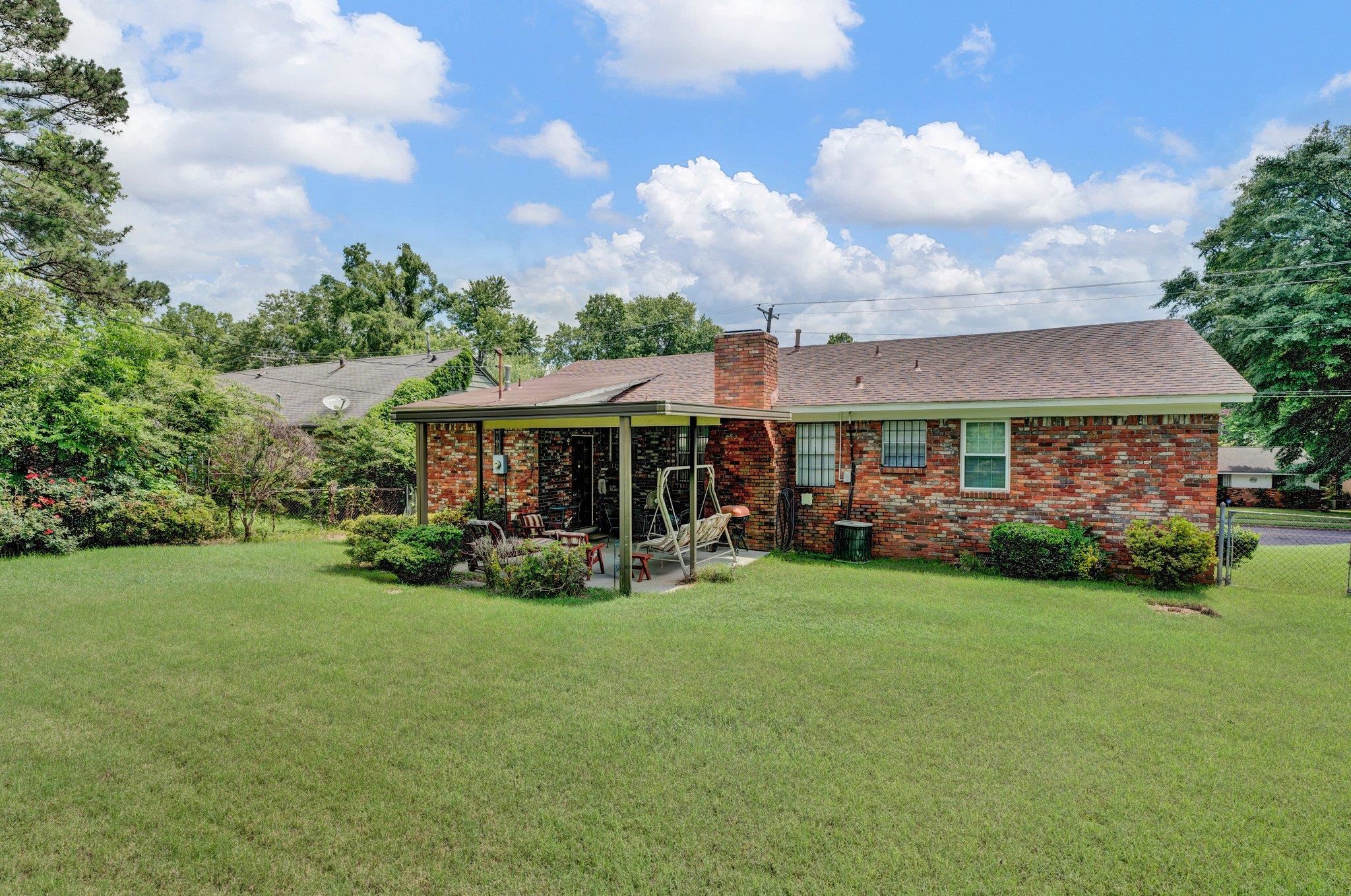 3273 Graves Road Memphis, TN 38116 - Photo 12 of 16 a view of a house with a yard and sitting area