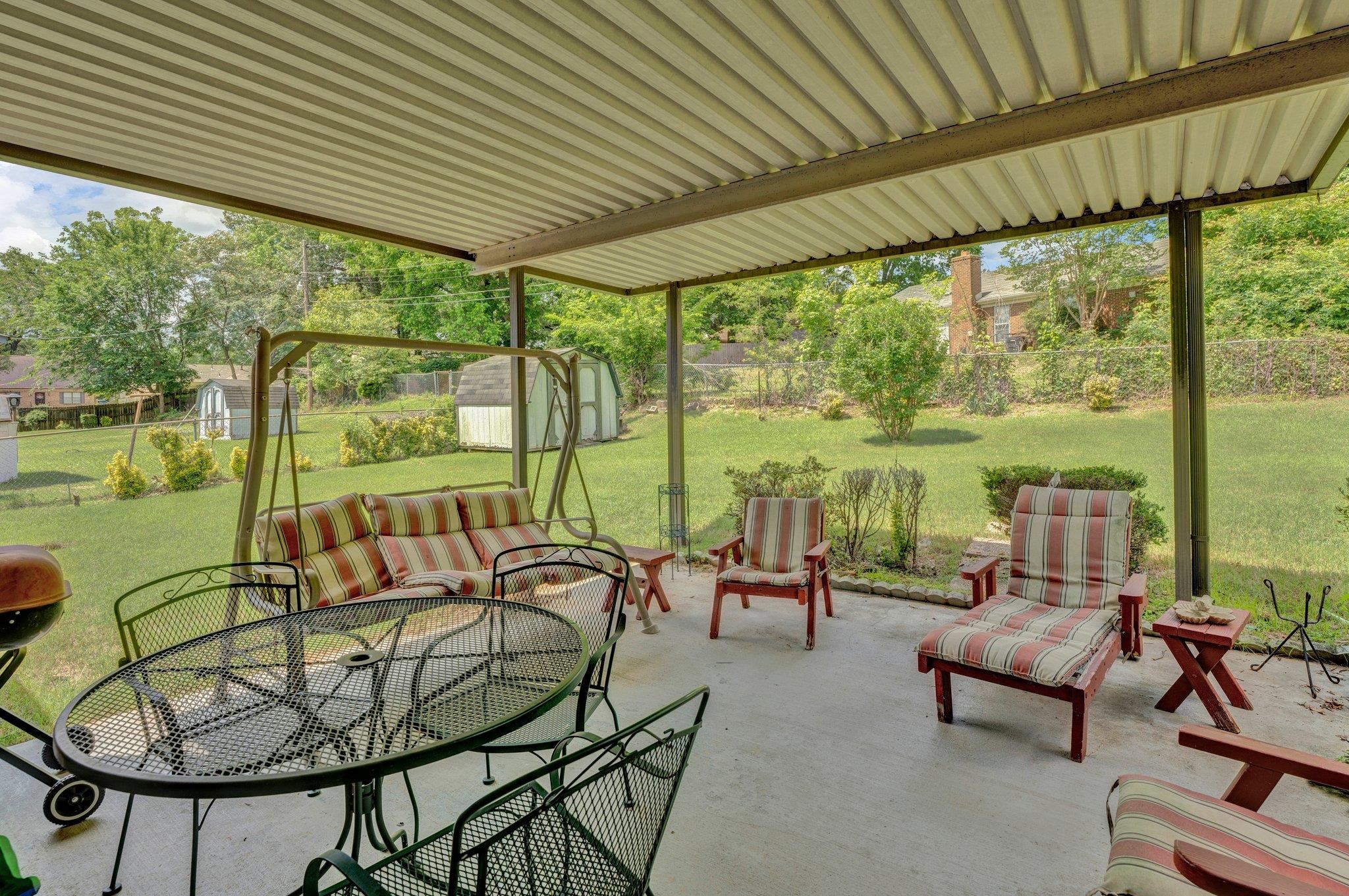 3273 Graves Road Memphis, TN 38116 - Photo 14 of 16 a building outdoor space with patio furniture and potted plants