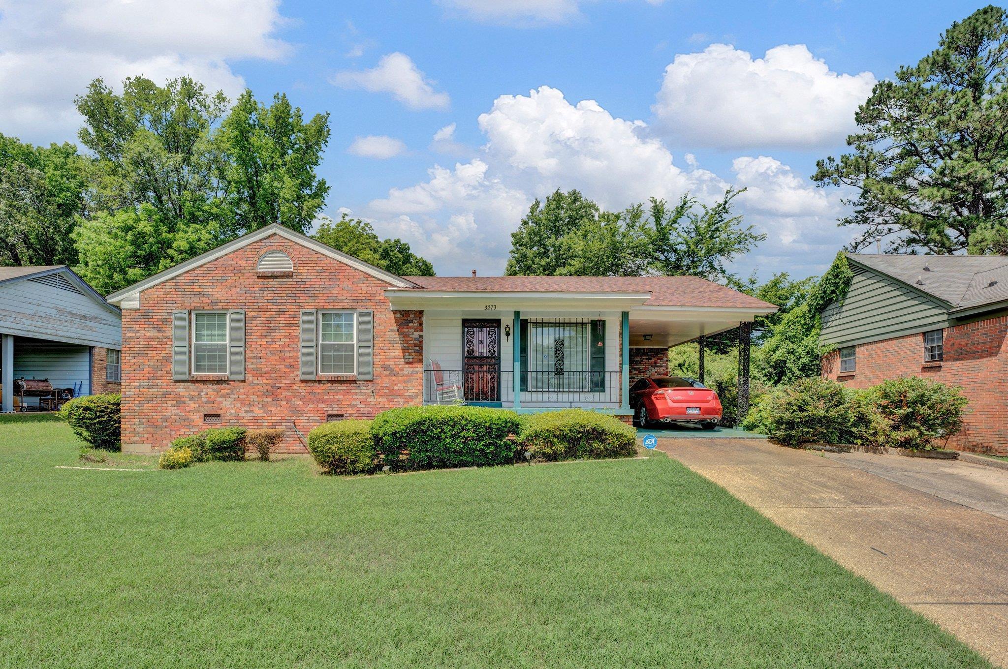 3273 Graves Road Memphis, TN 38116 - Photo 15 of 16 a front view of a house with a garden and plants