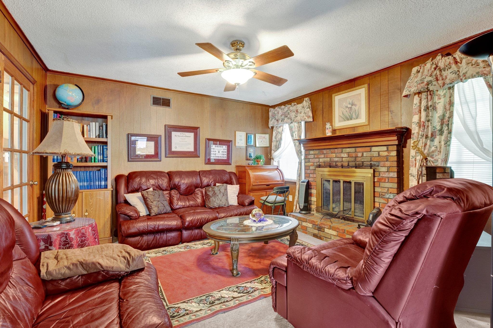 3273 Graves Road Memphis, TN 38116 - Photo 4 of 16 a living room with furniture a fireplace and a large window