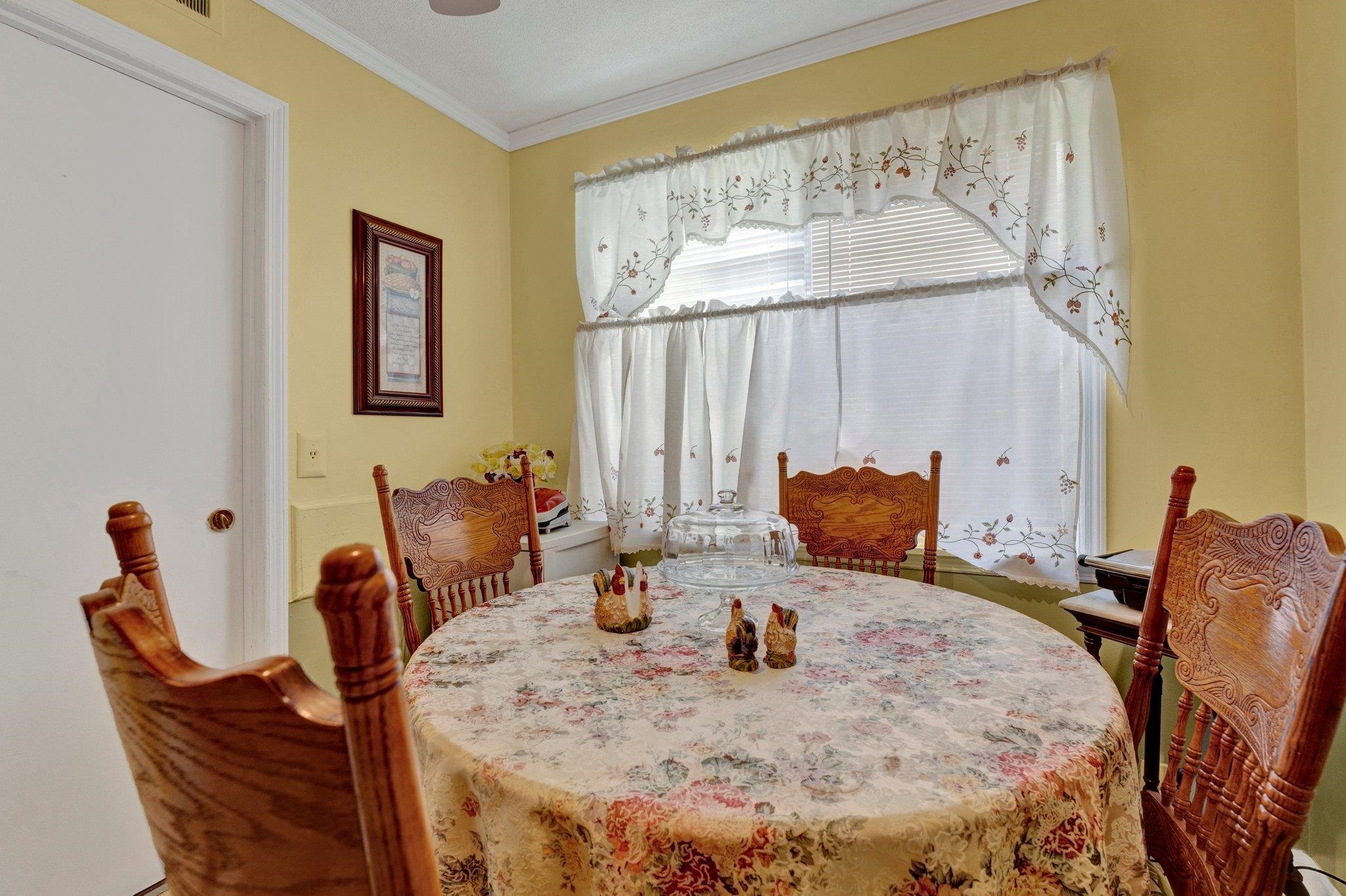 3273 Graves Road Memphis, TN 38116 - Photo 6 of 16 a view of a dining room with furniture and a large window