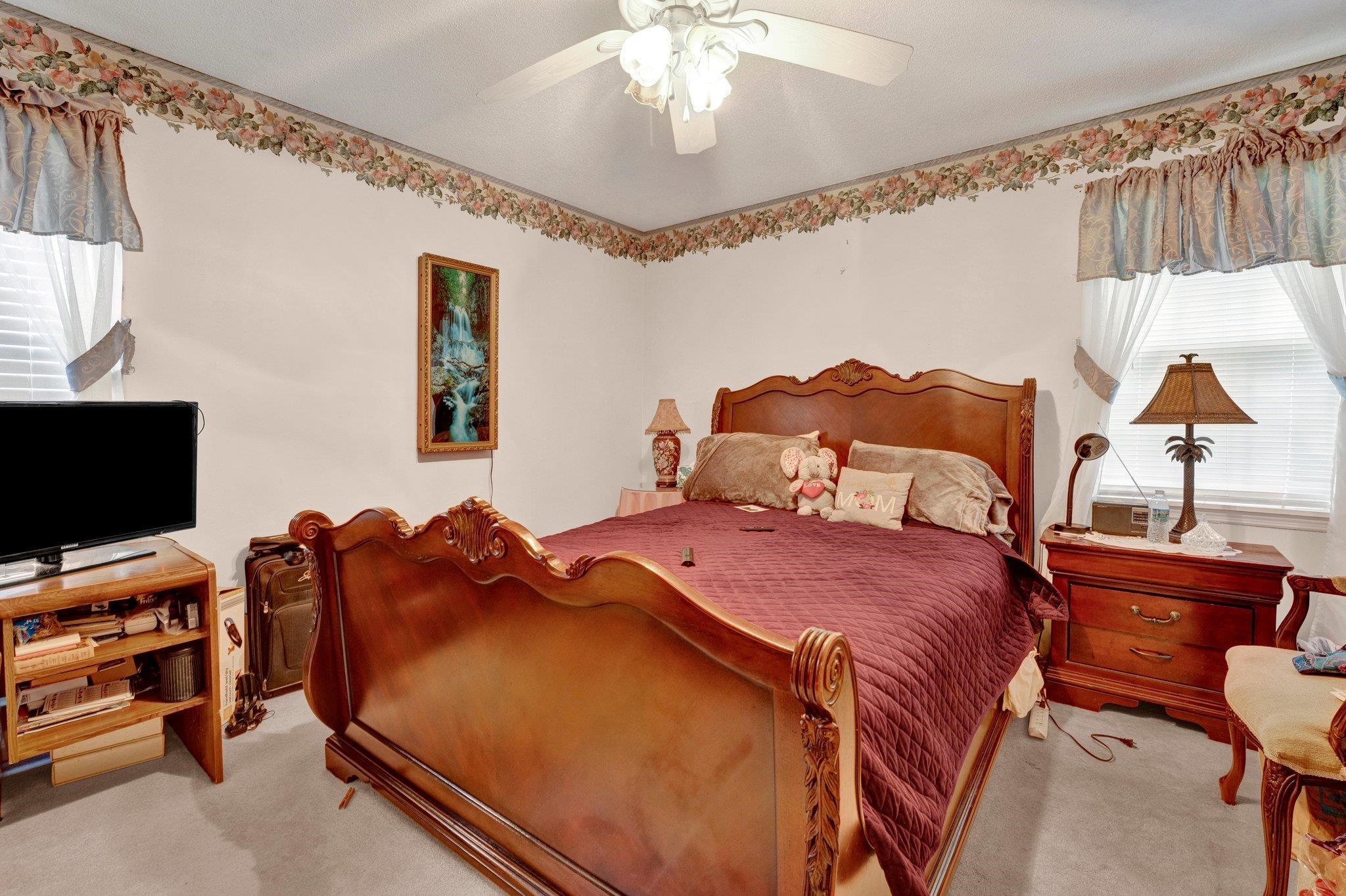 3273 Graves Road Memphis, TN 38116 - Photo 9 of 16 a bedroom with a bed and a flat screen tv