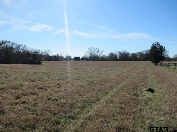 a view of lake with green space