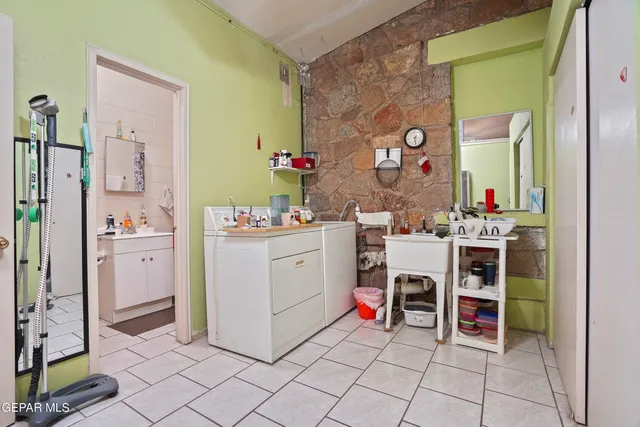 a room with furniture a washer and dryer