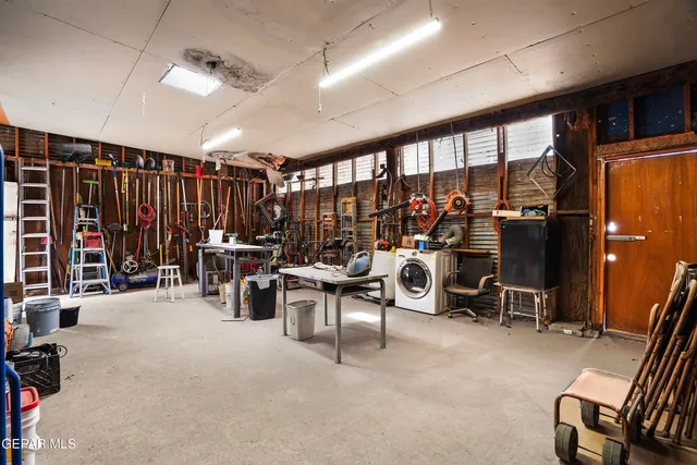 a view of a house with a snow in the background