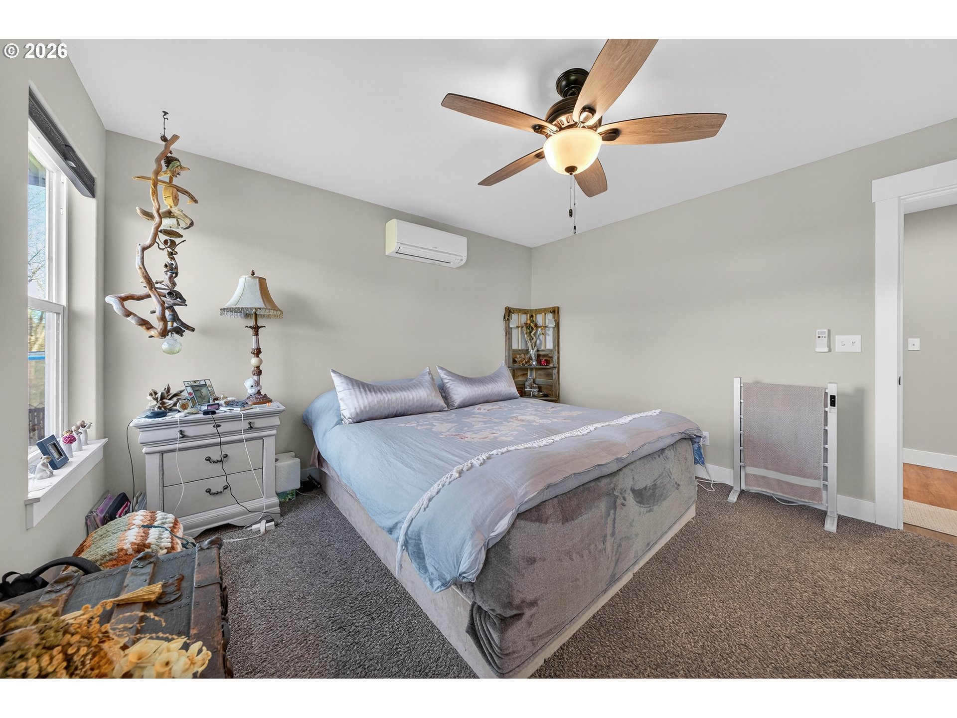 669 Northwest T Street Winston, OR 97496 - Photo 16 of 36 a bedroom with a bed and ceiling fan