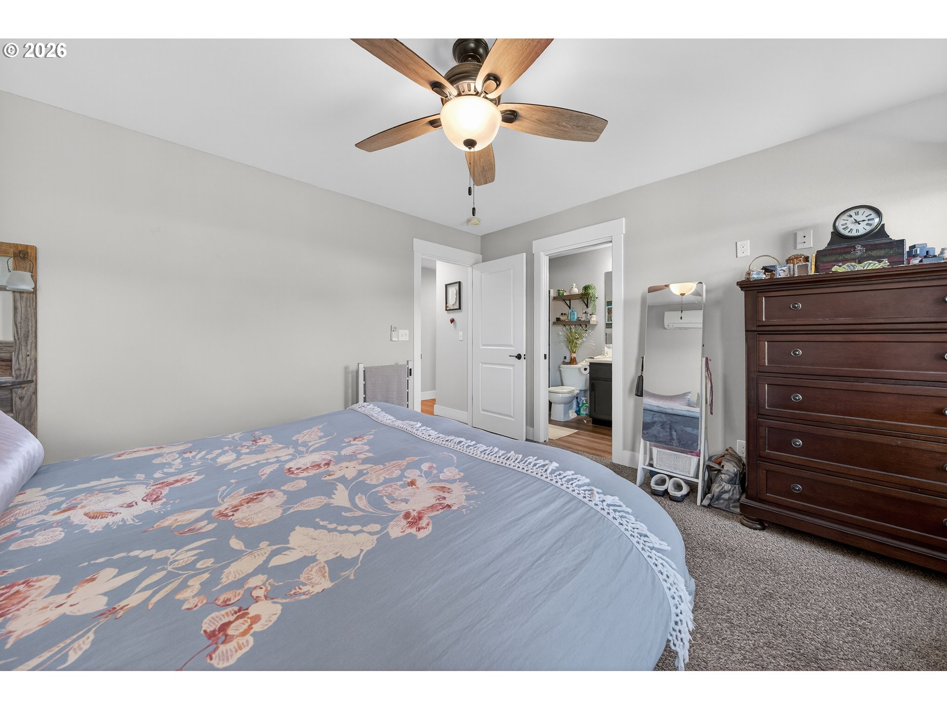669 Northwest T Street Winston, OR 97496 - Photo 17 of 36 a bedroom with a bed and a chandelier