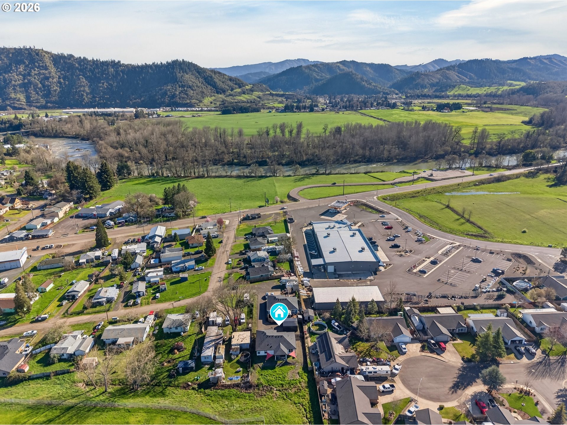 669 Northwest T Street Winston, OR 97496 - Photo 19 of 36 an aerial view of a house with a garden and lake view