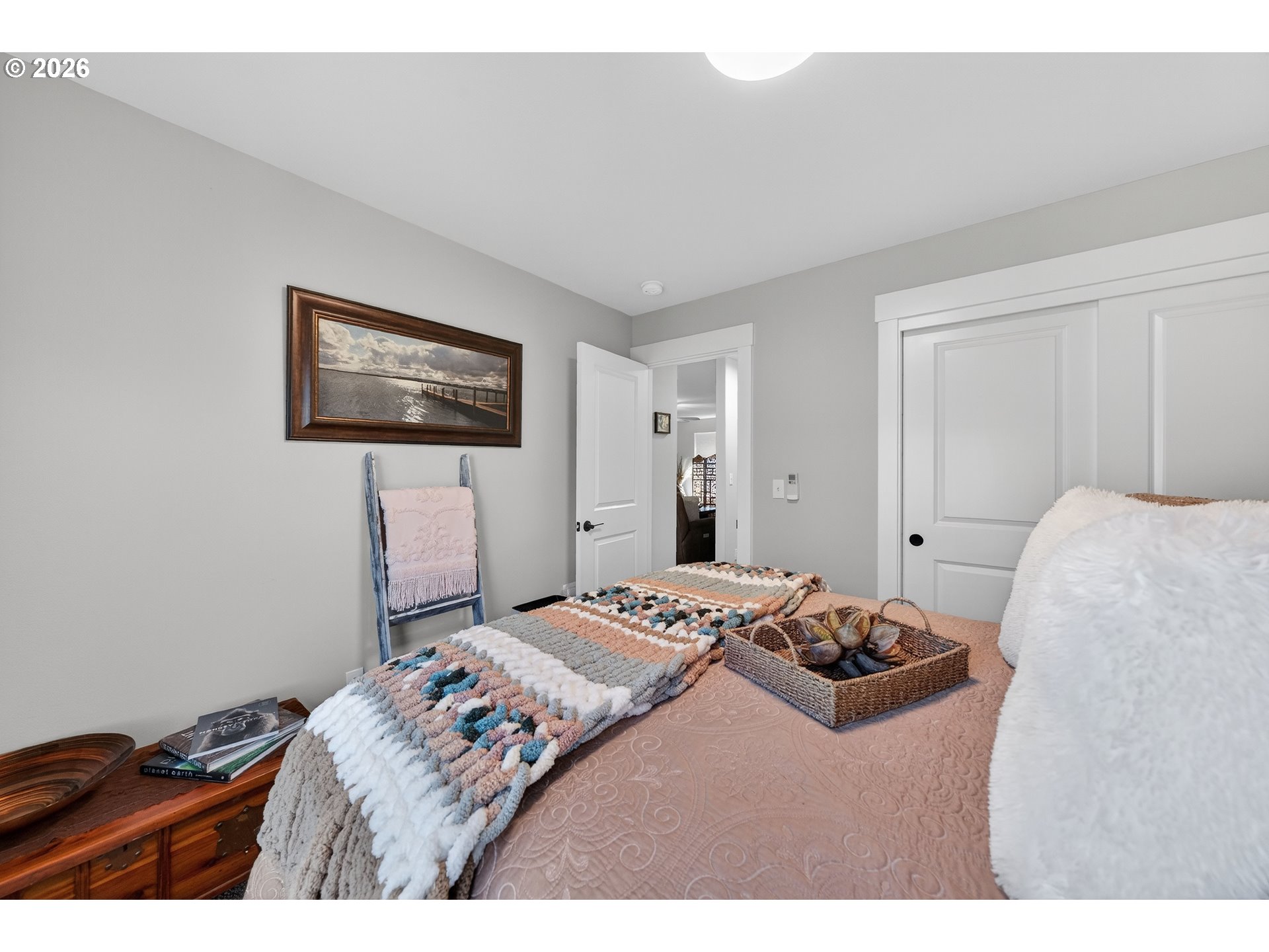 669 Northwest T Street Winston, OR 97496 - Photo 23 of 36 a bedroom with a bed and a painting on the wall