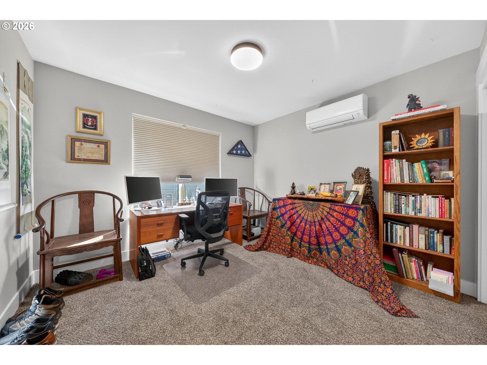 669 Northwest T Street Winston, OR 97496 - Photo 25 of 36 a bed room with a bed and a book shelf