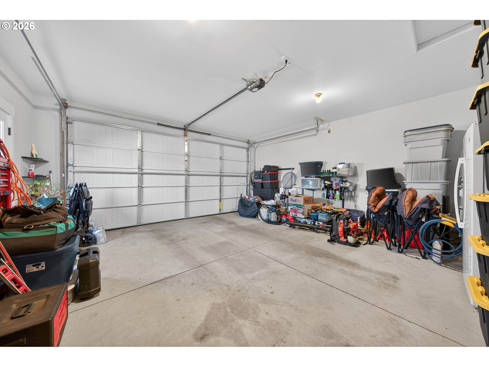 669 Northwest T Street Winston, OR 97496 - Photo 28 of 36 a view of a garage with a bike and car