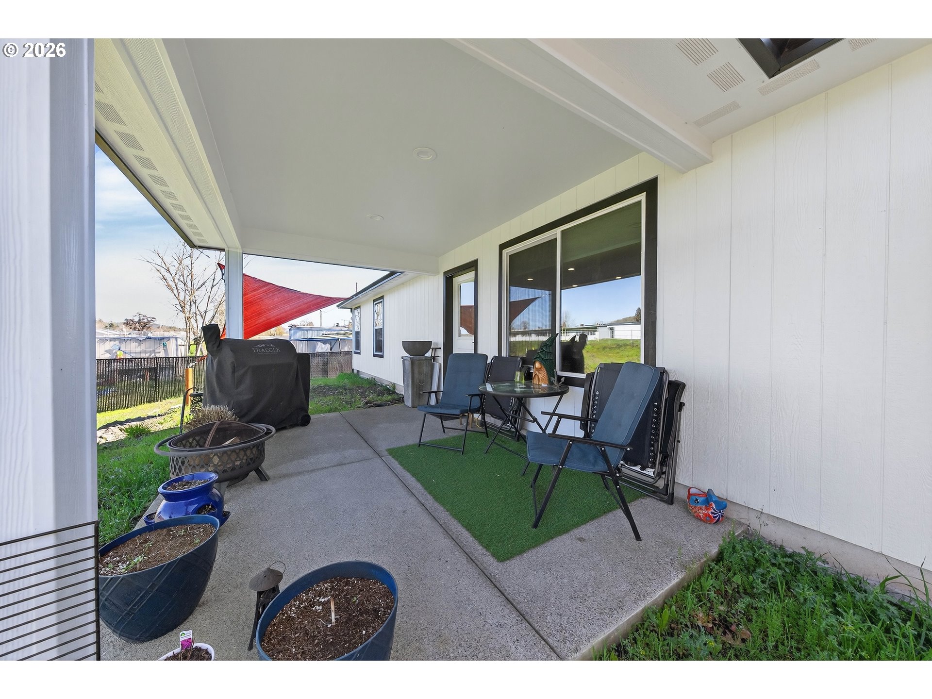 669 Northwest T Street Winston, OR 97496 - Photo 31 of 36 a living room with furniture and a flat screen tv