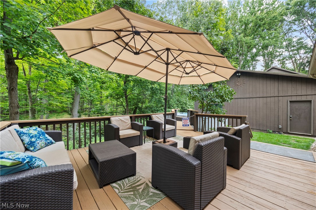 7587 Lewis Road Olmsted Falls, OH 44138 - Photo 45 of 50 Expansive wood deck with a full railing system, surrounded by mature trees