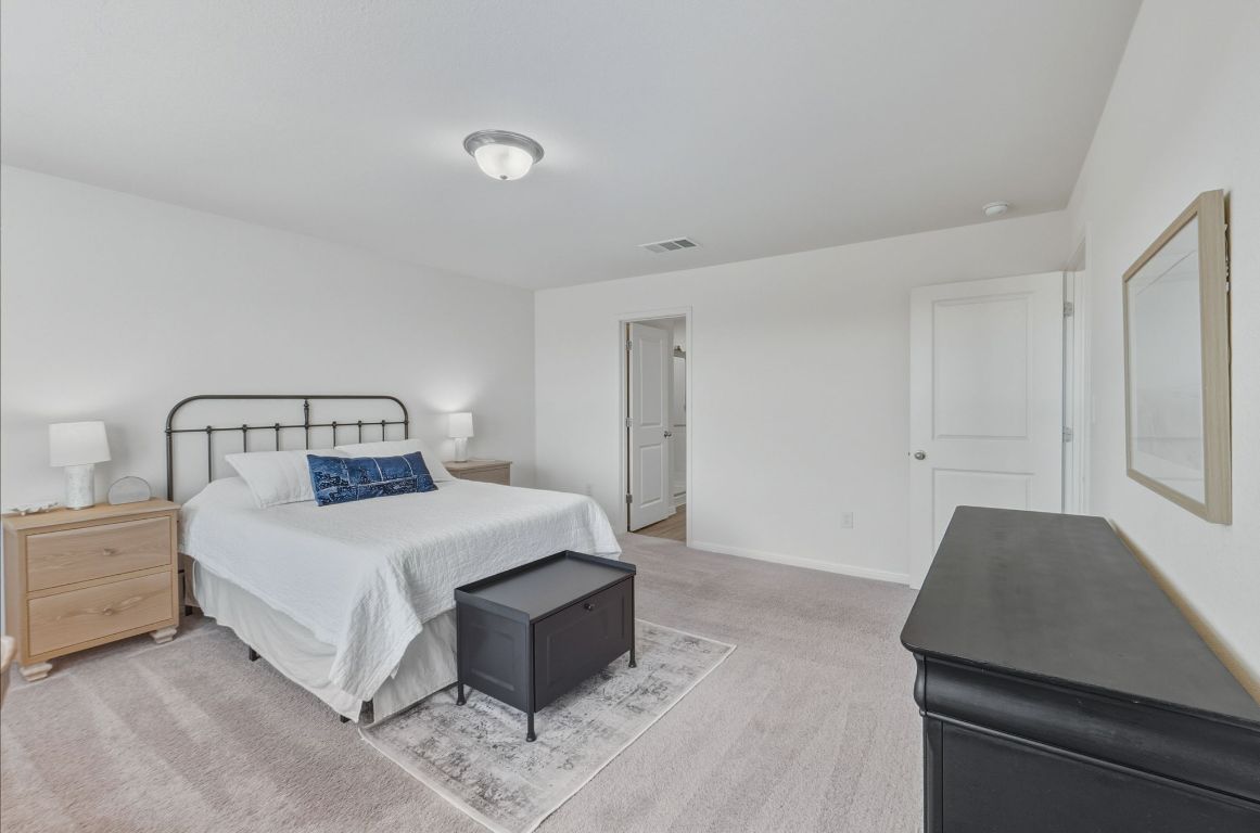 201 Wonderful Life Way Jarrell, TX 76537 - Photo 21 of 39 Spacious oversized primary bedroom. Located on upper level.