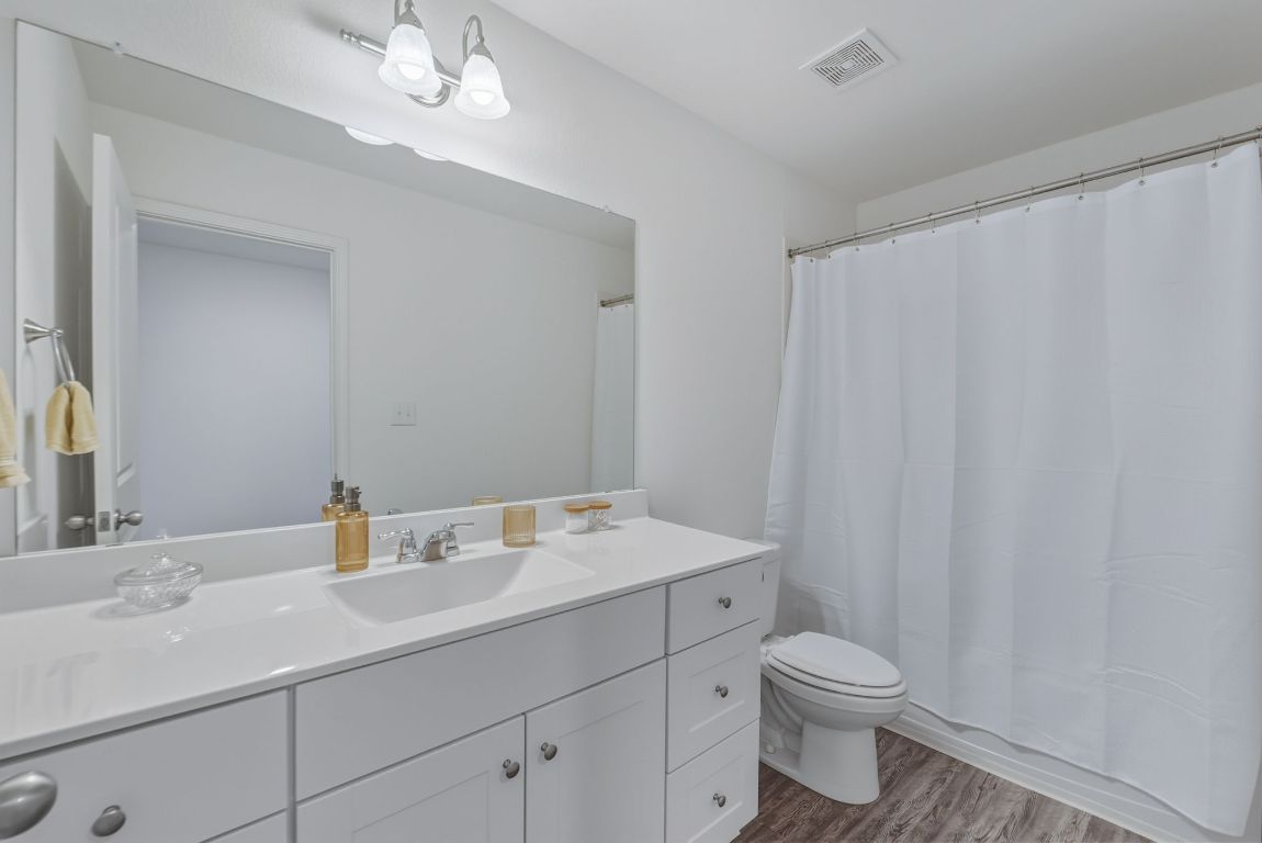 201 Wonderful Life Way Jarrell, TX 76537 - Photo 31 of 39 Third full bathroom with vanity, a tub/shower combo. located on upper floor.