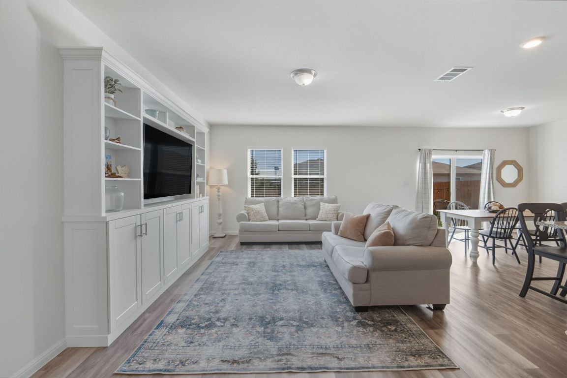 201 Wonderful Life Way Jarrell, TX 76537 - Photo 36 of 39 Living room with light wood finished floors and plenty of natural light. Open & spacious floor plan.