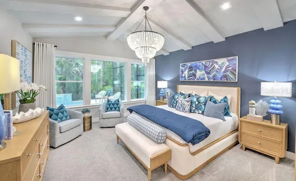 a bed room with a bed and a chandelier