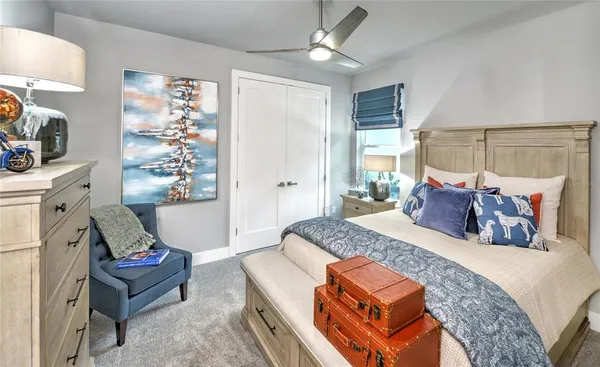 a bed room with a bed and a chandelier