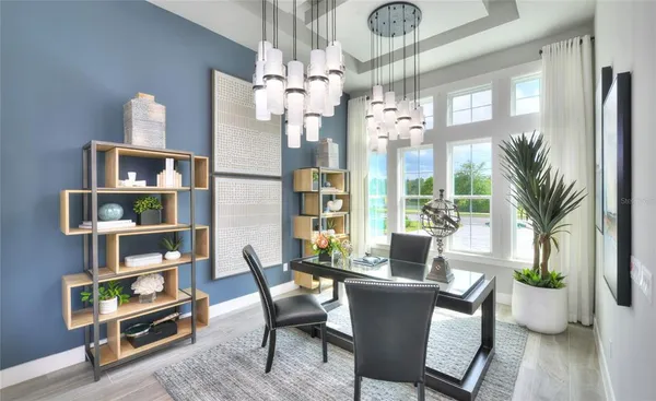 a dining room with furniture and wooden floor