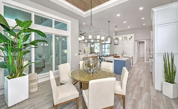 a dining room with furniture a livingroom and chandelier