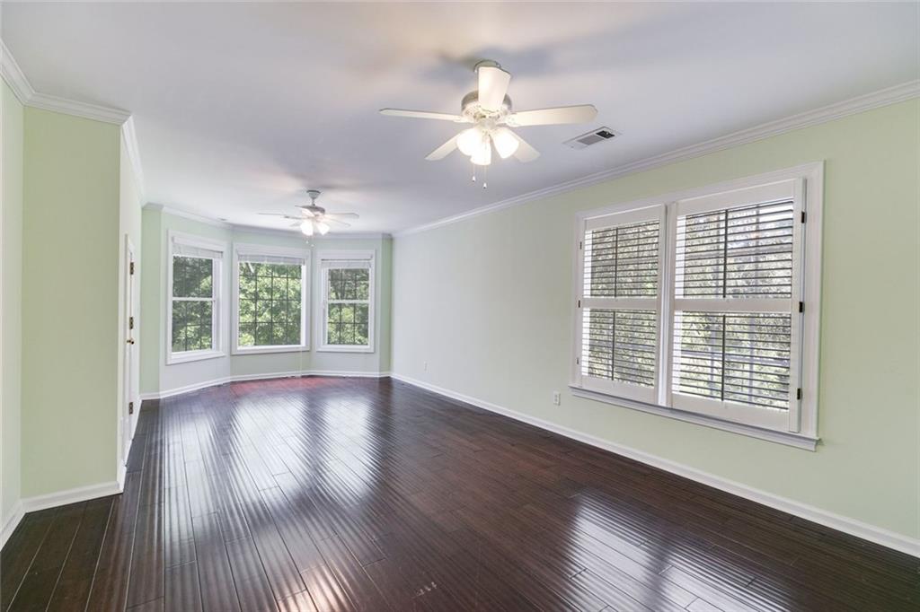 110 Pond View Point LaGrange, GA 30240 - Photo 45 of 68 a view of an empty room with wooden floor and a window