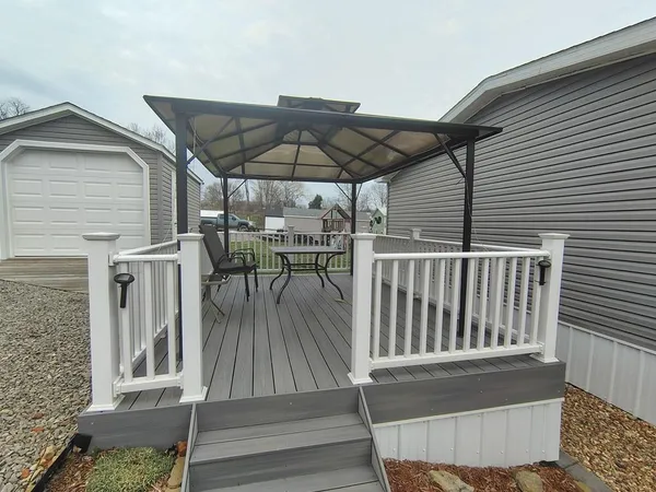 a view of balcony with furniture