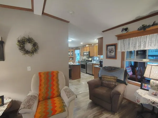 a kitchen with stainless steel appliances granite countertop a sink stove and microwave