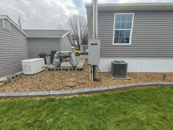 a top view of a house with backyard and sitting area
