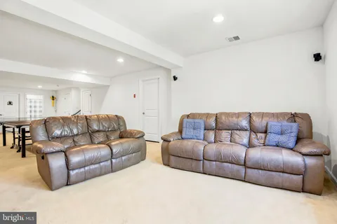 a living room with a couch and a couch