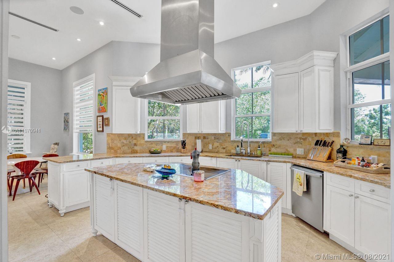 12260 Southwest 95th Avenue Miami, FL 33176 - Photo 13 of 98 a kitchen with a sink stove and cabinets