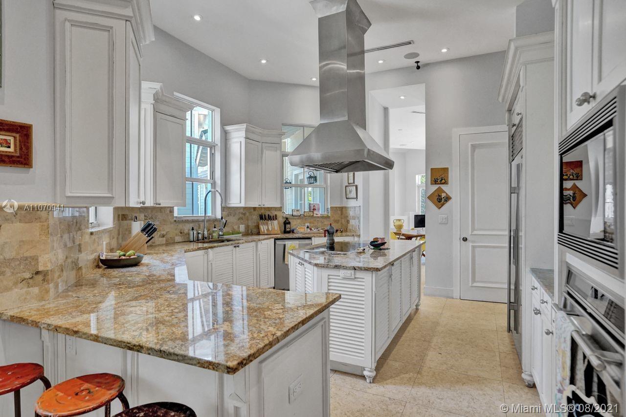 12260 Southwest 95th Avenue Miami, FL 33176 - Photo 14 of 98 a kitchen with stainless steel appliances granite countertop a sink stove and refrigerator