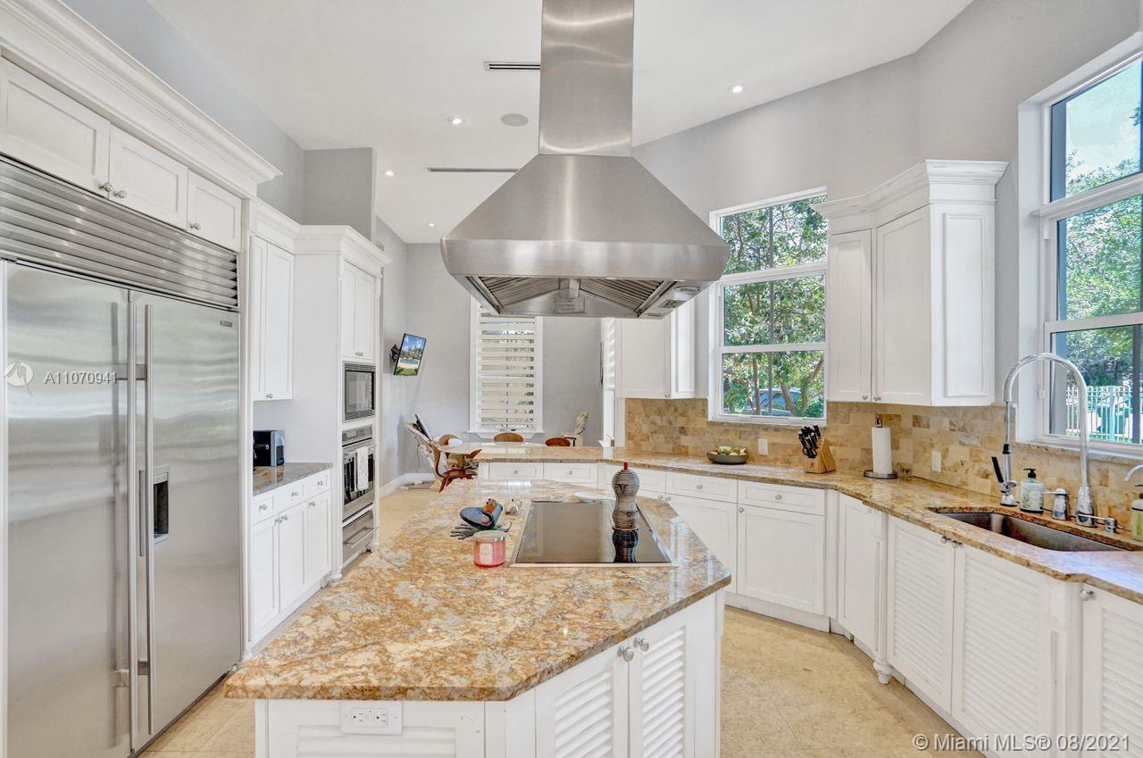 12260 Southwest 95th Avenue Miami, FL 33176 - Photo 15 of 98 a open kitchen with stainless steel appliances granite countertop a sink stove and refrigerator
