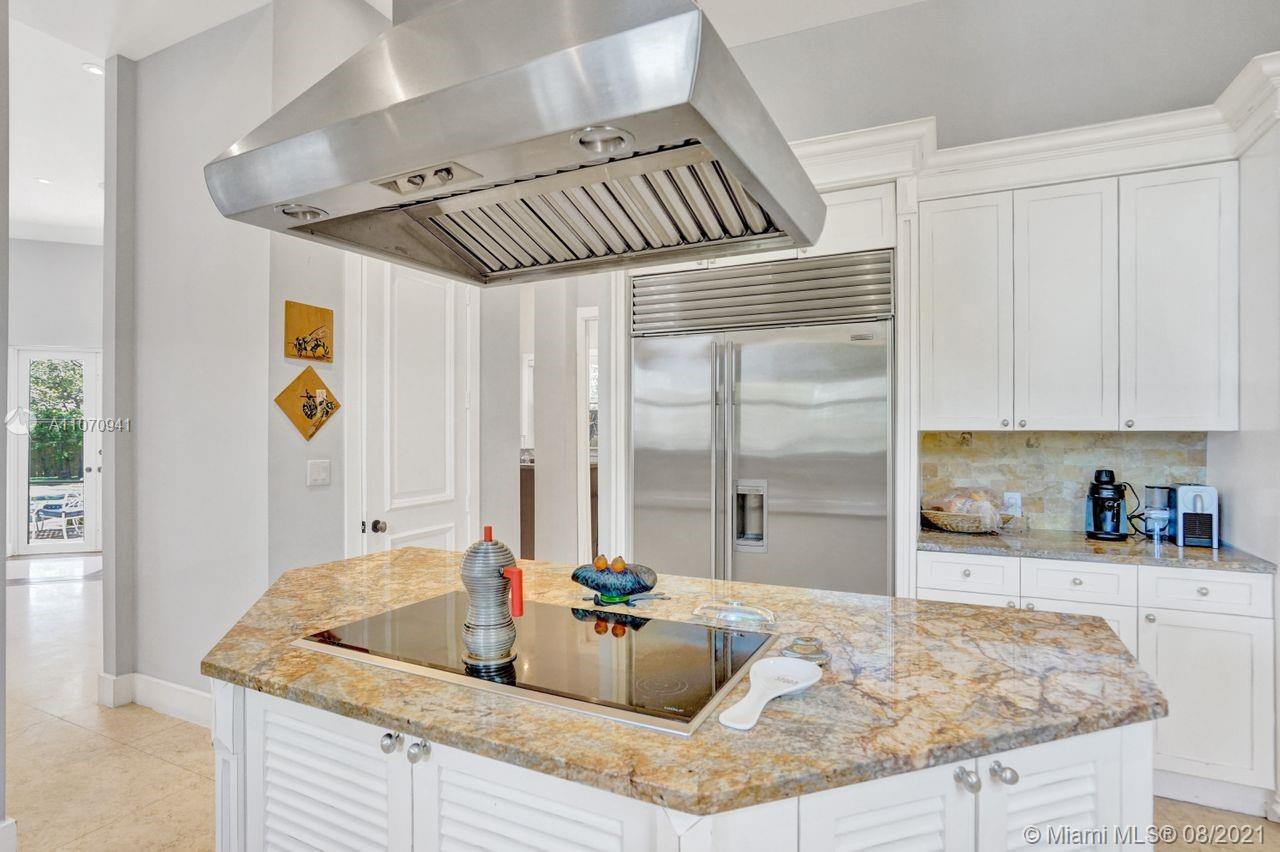 12260 Southwest 95th Avenue Miami, FL 33176 - Photo 16 of 98 a kitchen with kitchen island granite countertop a sink and a counter top space