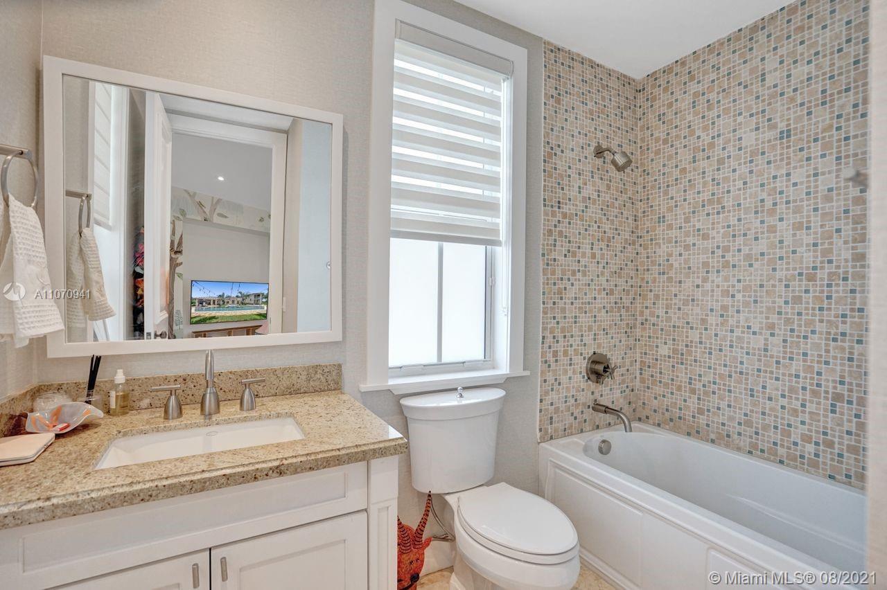 12260 Southwest 95th Avenue Miami, FL 33176 - Photo 44 of 98 a bathroom with a granite countertop sink toilet and shower