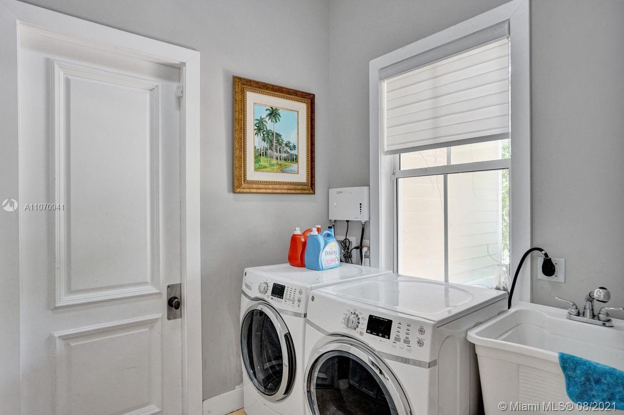 12260 Southwest 95th Avenue Miami, FL 33176 - Photo 59 of 98 a view of storage and utility room with washer and dryer