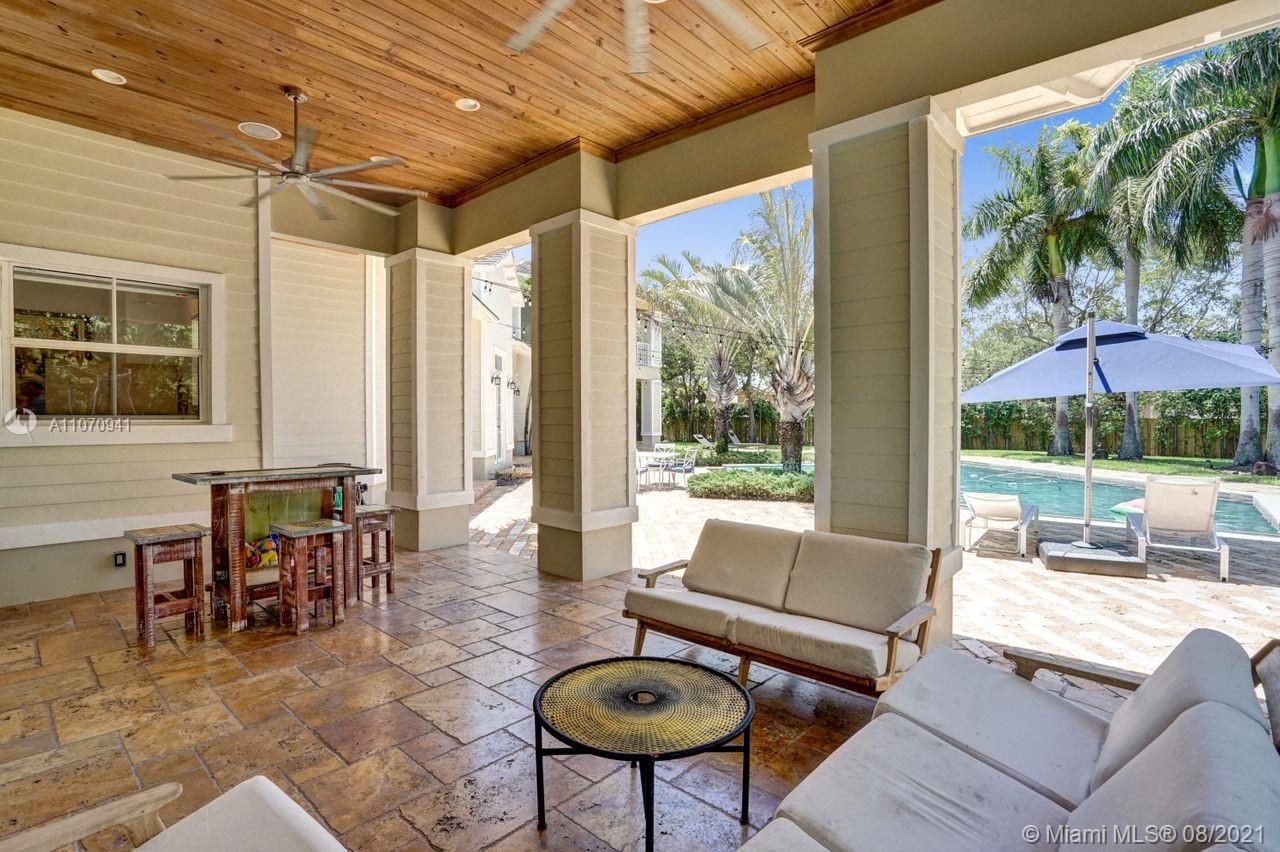 12260 Southwest 95th Avenue Miami, FL 33176 - Photo 73 of 98 a living room filled with furniture and a floor to ceiling window