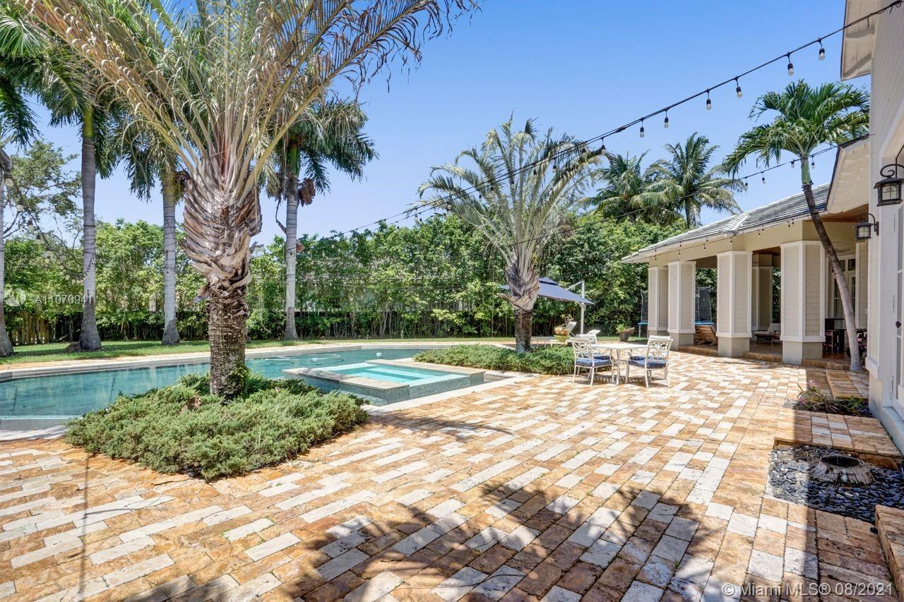 12260 Southwest 95th Avenue Miami, FL 33176 - Photo 87 of 98 a house with palm tree in front of it