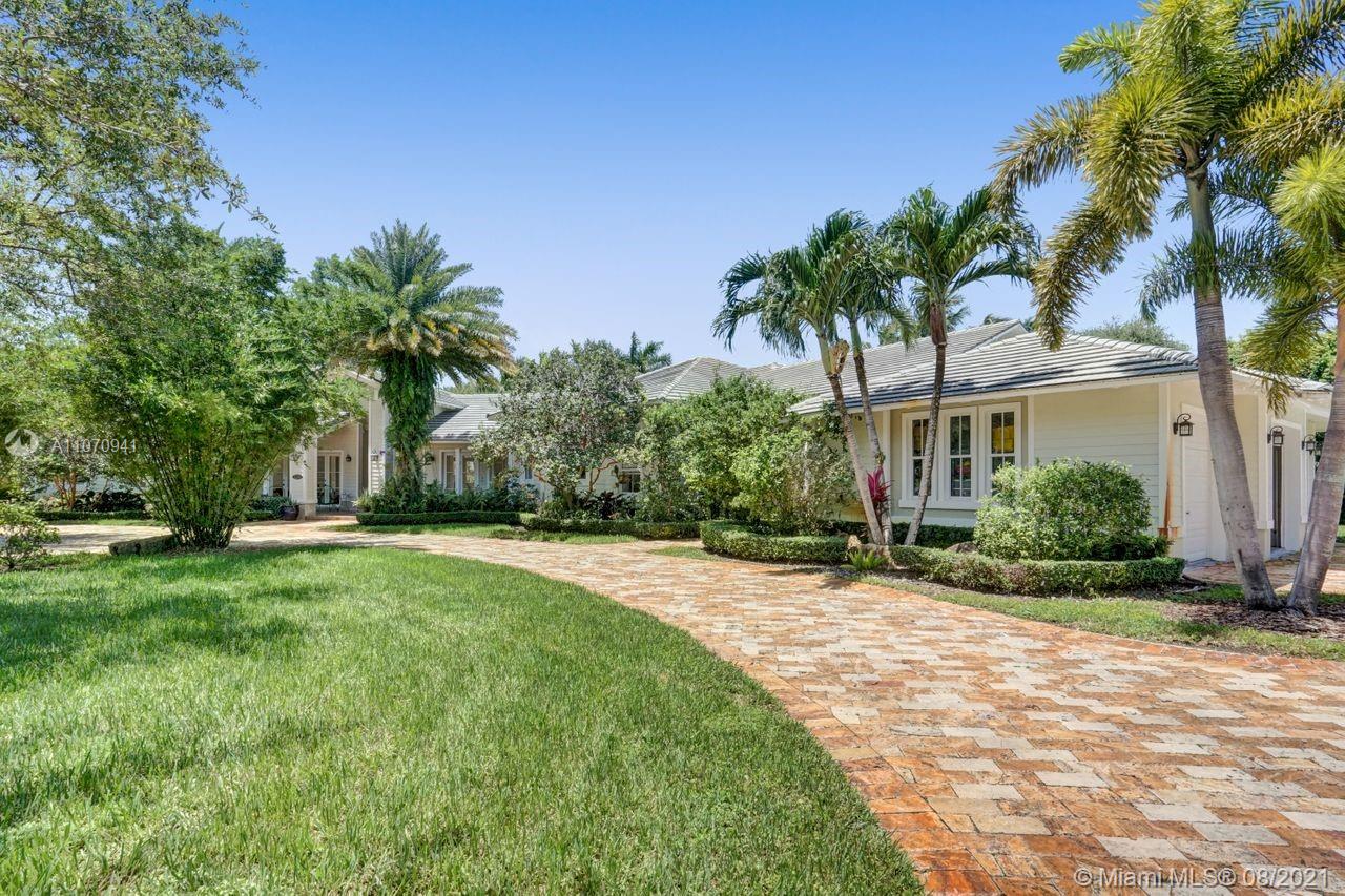 12260 Southwest 95th Avenue Miami, FL 33176 - Photo 90 of 98 a front view of house with yard and green space