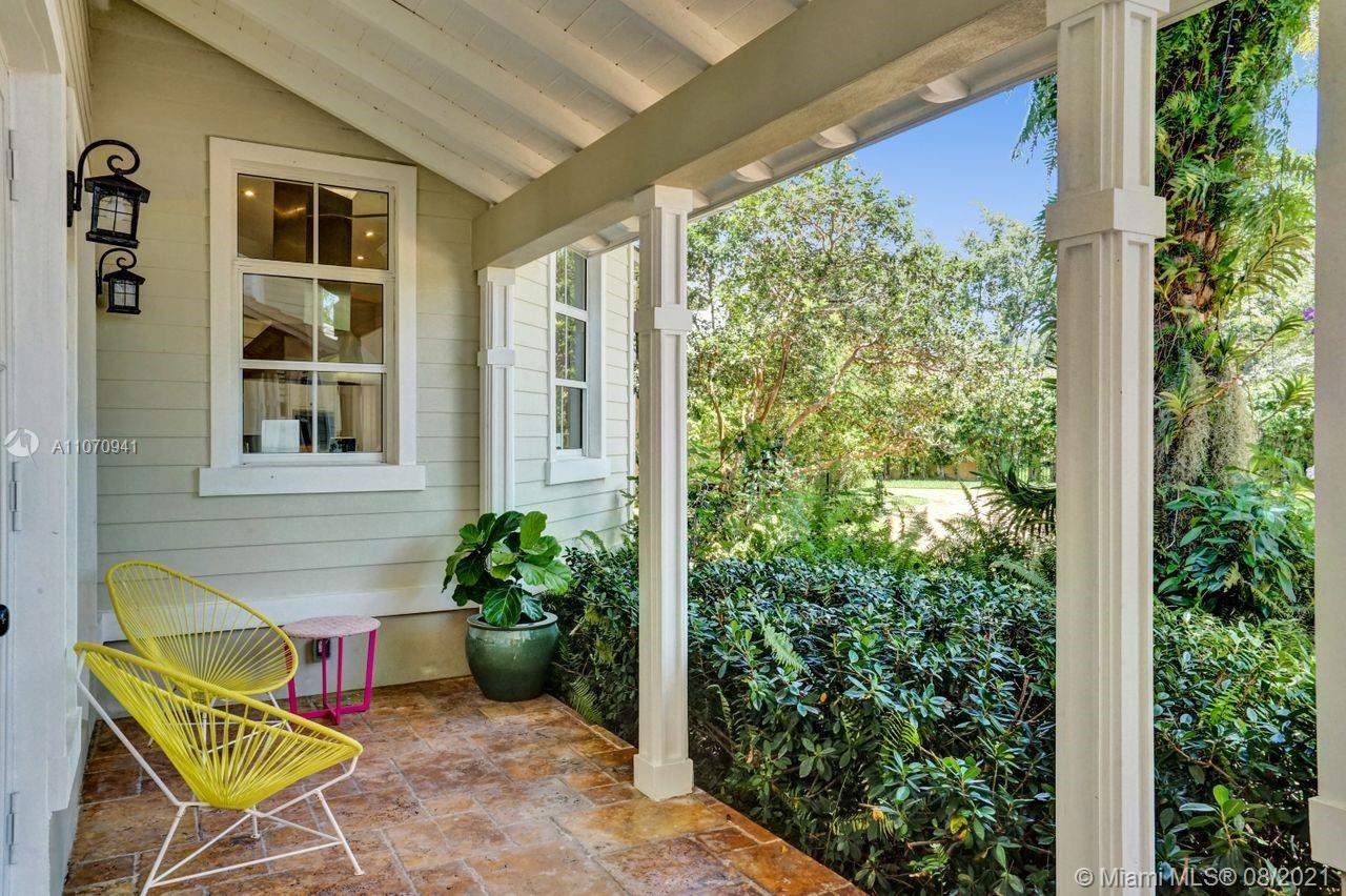 12260 Southwest 95th Avenue Miami, FL 33176 - Photo 10 of 98 a view of a porch with a chairs and potted plants