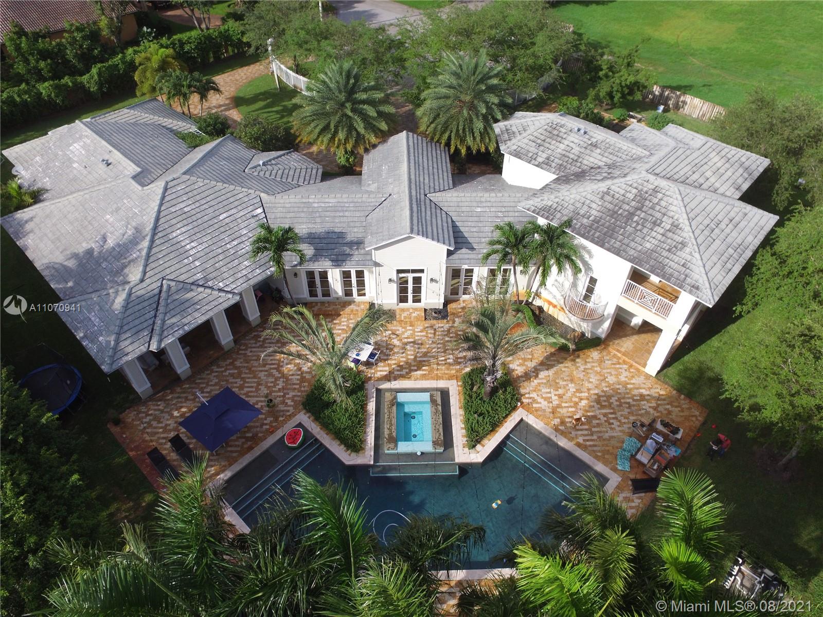 12260 Southwest 95th Avenue Miami, FL 33176 - Photo 94 of 98 an aerial view of a house with a garden space and lake view