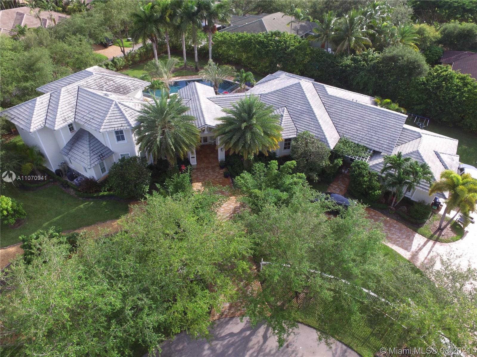 12260 Southwest 95th Avenue Miami, FL 33176 - Photo 95 of 98 an aerial view of a house with garden space and a street view