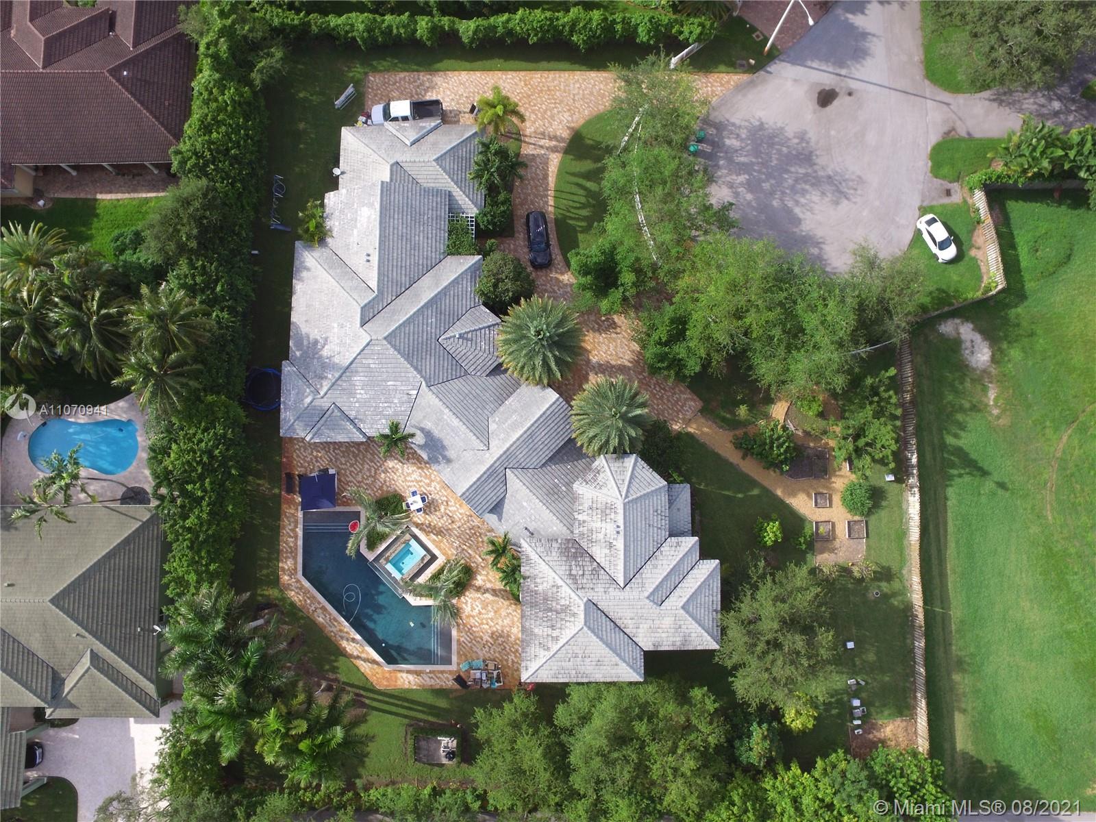 12260 Southwest 95th Avenue Miami, FL 33176 - Photo 98 of 98 an aerial view of house with yard swimming pool and outdoor seating