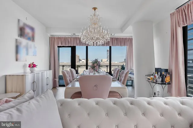 a balcony with furniture and a potted plant