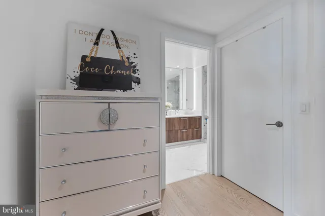 a bathroom with a shower sink double vanity and mirror